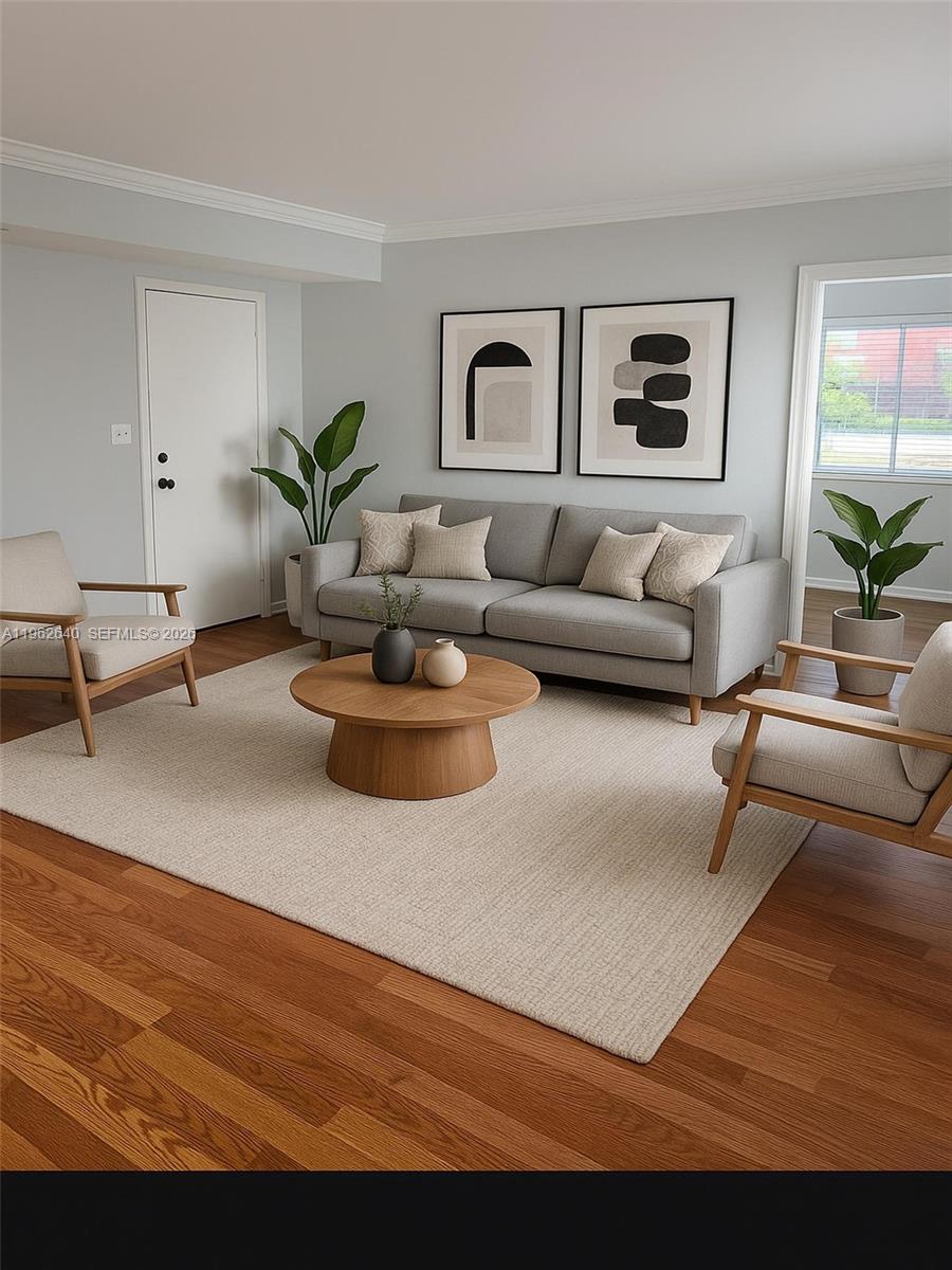103 Northwest 6th Avenue, Unit 2 Miami, FL 33128 - Photo 1 of 20 a living room with furniture and wooden floor