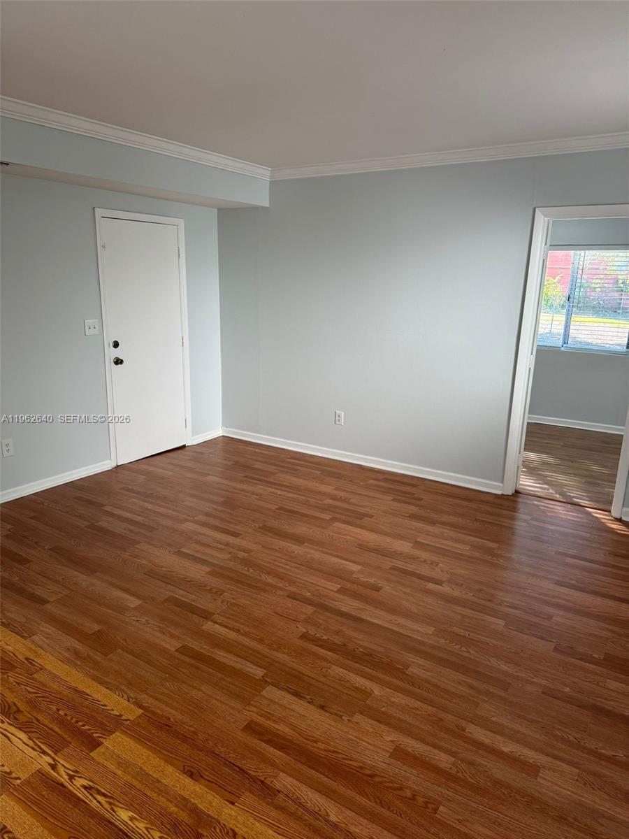 103 Northwest 6th Avenue, Unit 2 Miami, FL 33128 - Photo 15 of 20 a view of empty room with wooden floor