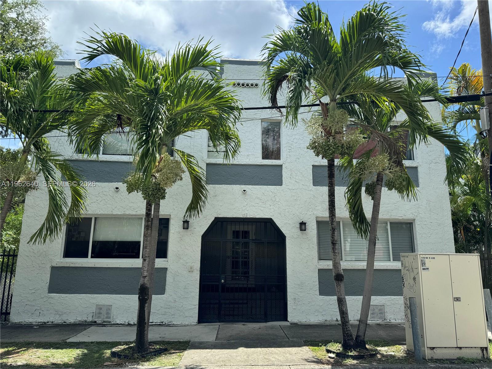 103 Northwest 6th Avenue, Unit 2 Miami, FL 33128 - Photo 10 of 20 a front view of a house with balcony