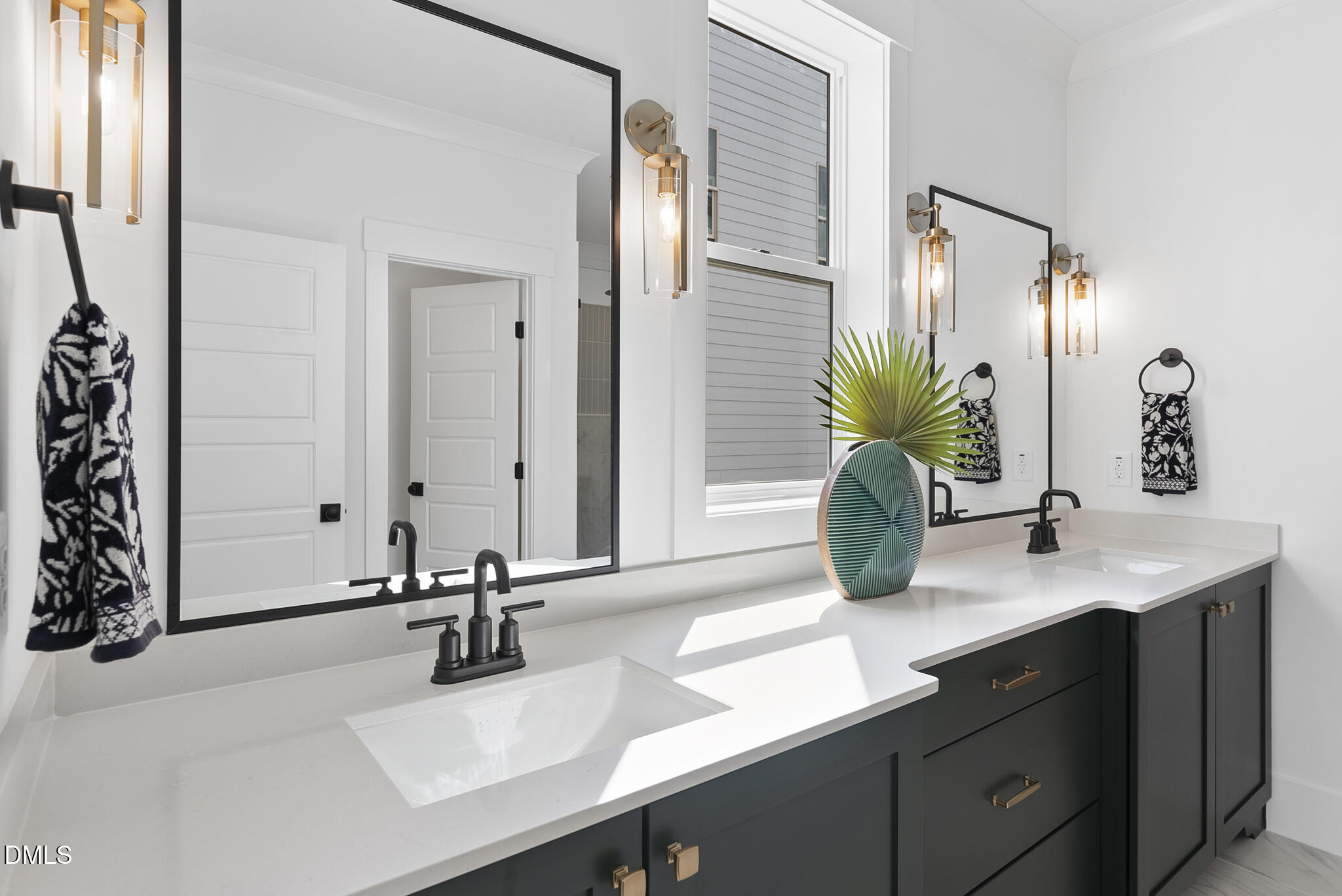 761 West Holly Springs Road Holly Springs, NC 27540 - Photo 36 of 61 a bathroom with a sink double vanity and a mirror