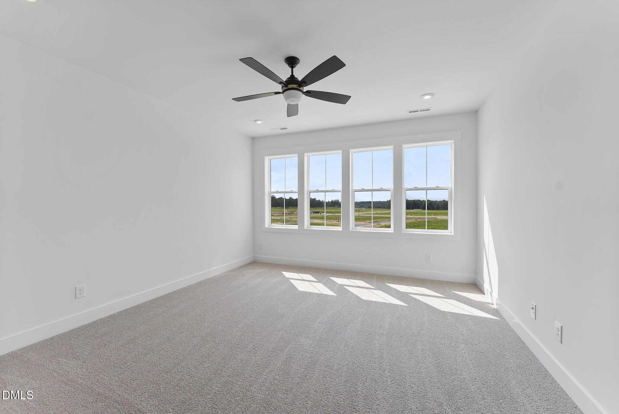 761 West Holly Springs Road Holly Springs, NC 27540 - Photo 42 of 61 a view of an empty room with a window