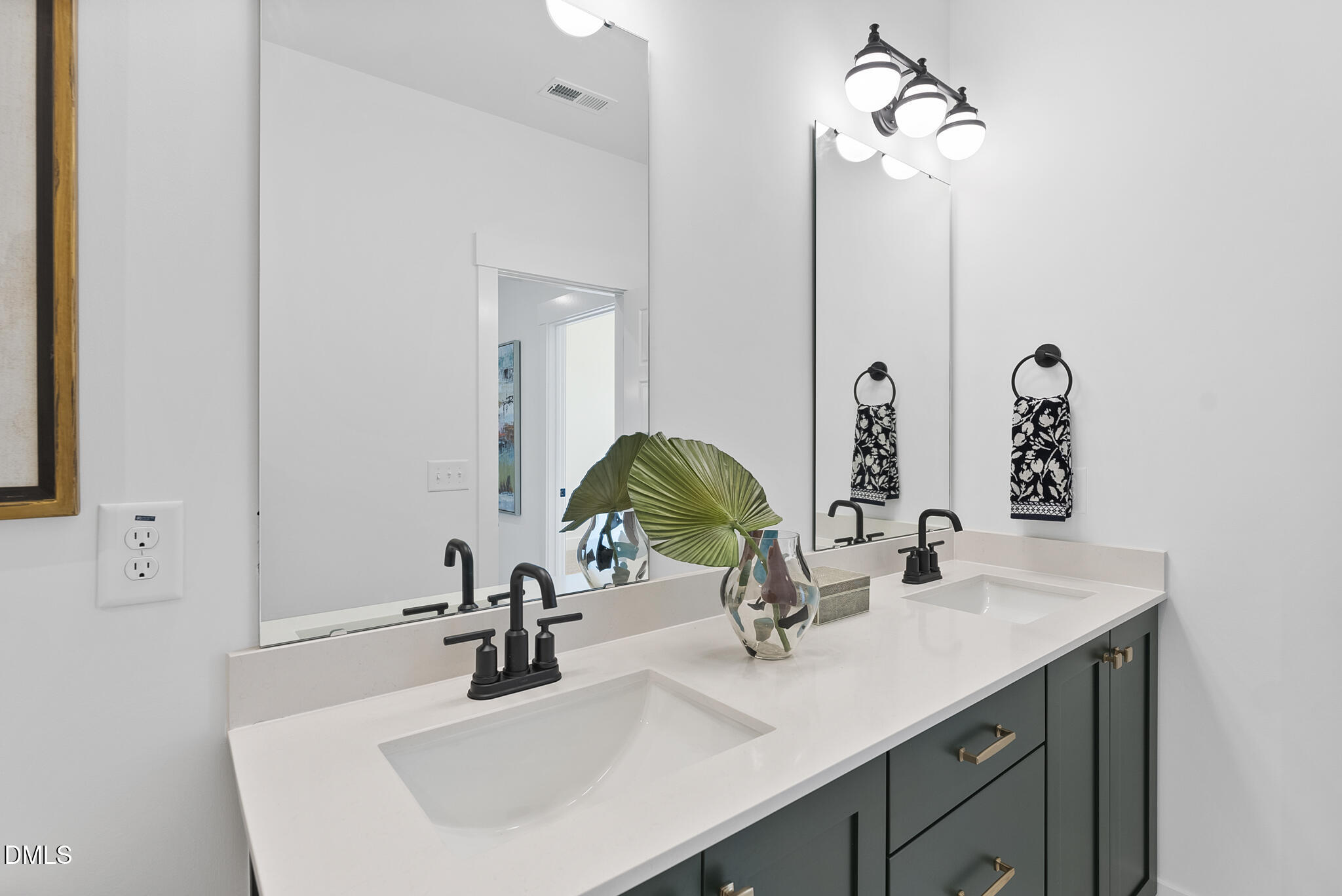 761 West Holly Springs Road Holly Springs, NC 27540 - Photo 47 of 61 a bathroom with a sink and a mirror
