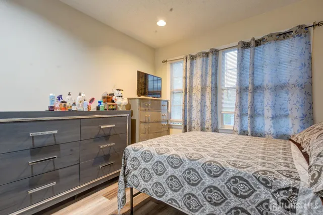 a bedroom with a bed and a dresser