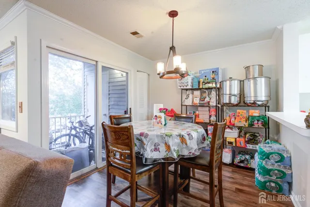 a bedroom with furniture and a chandelier