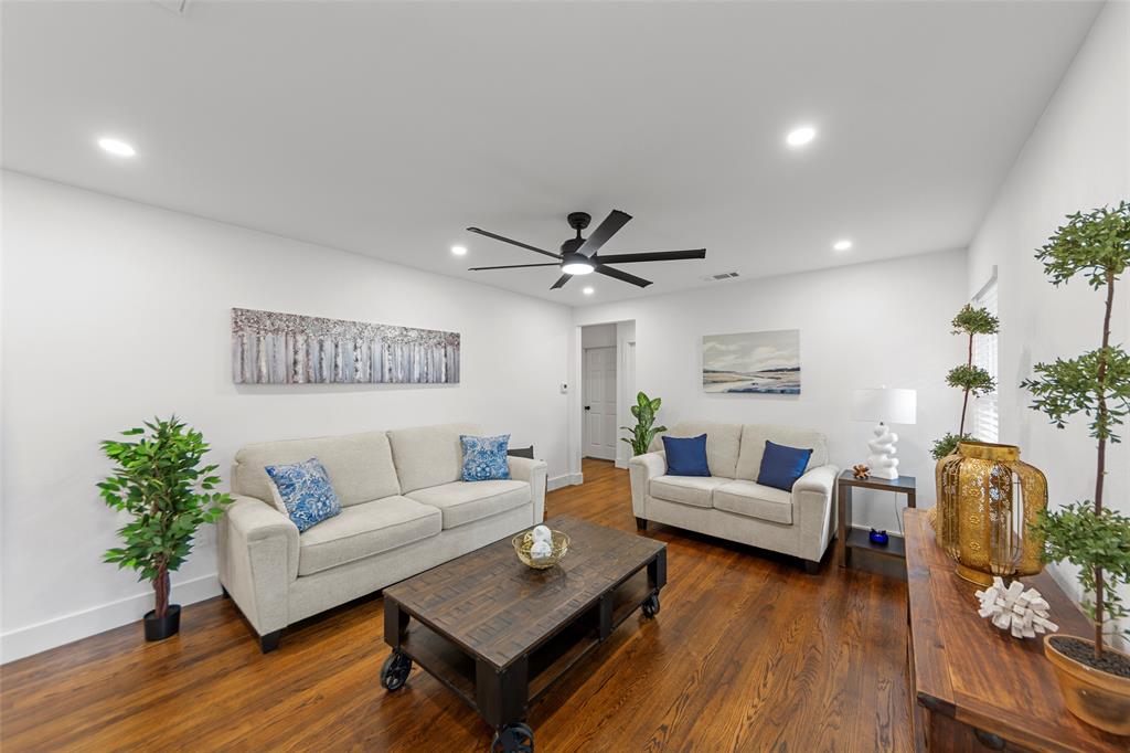 2945 Healey Drive Dallas, TX 75228 - Photo 1 of 38 a living room with furniture and a wooden floor