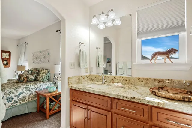 a view of a house with swimming pool and sitting area