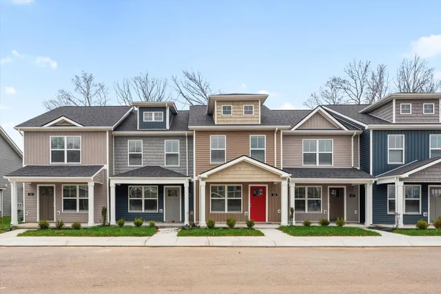 a front view of a residential houses with street