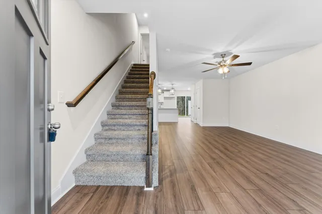 a view of an entryway with wooden floor