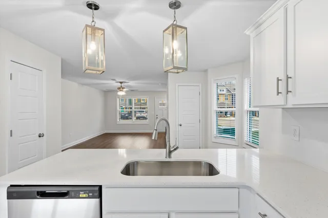 a view of wooden floor and windows in a room