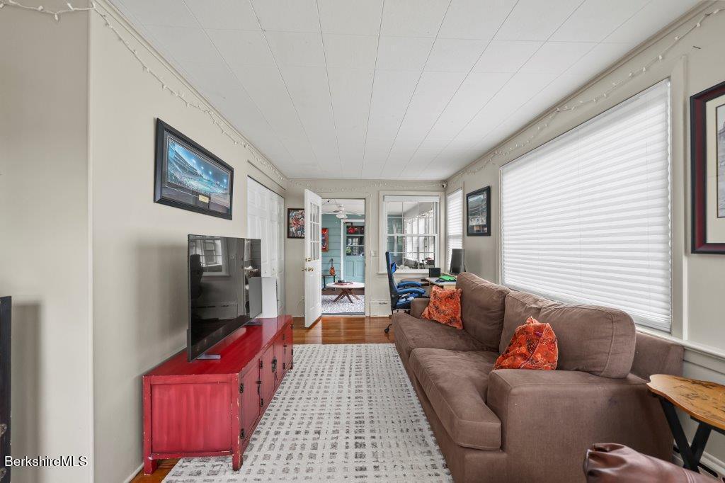 33 Eleanor Road Pittsfield, MA 01201 - Photo 22 of 45 a living room with furniture and a flat screen tv
