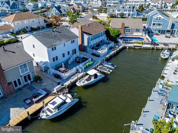 an aerial view of a house with a ocean view