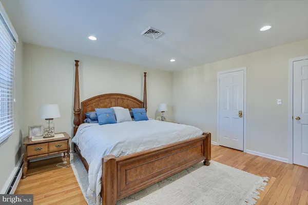 a bedroom with a bunk bed and a window