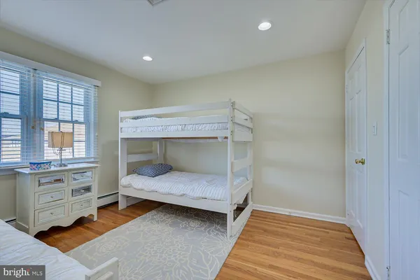 a bedroom with furniture and a window