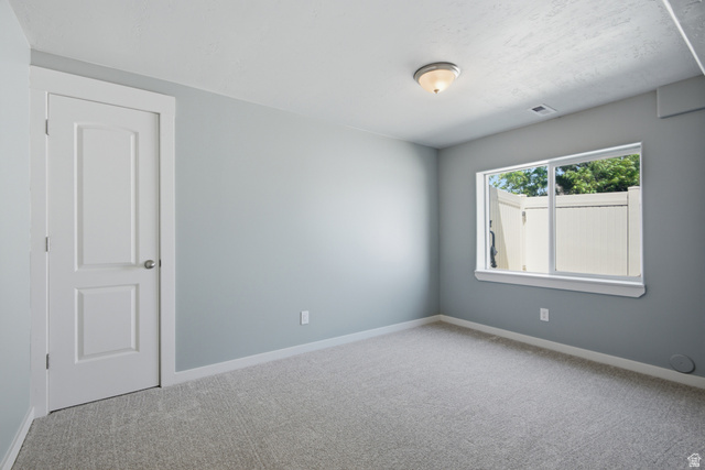 1252 Skyline Road Saratoga Springs, UT 84045 - Photo 39 of 51 Light gray wall paint complemented by white trim and a paneled door