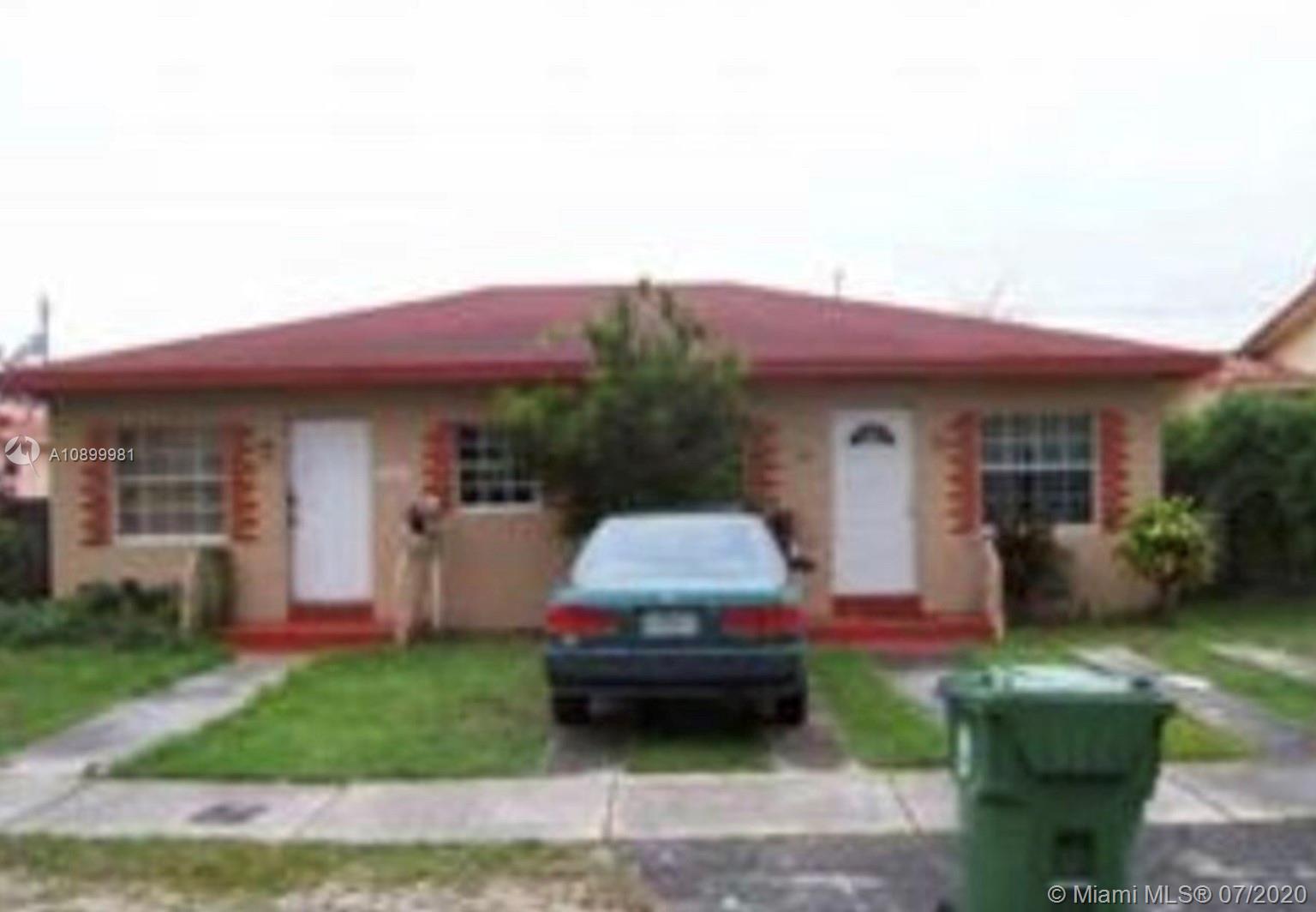 3431 Southwest 16th Terrace Miami, FL 33145 - Photo 1 of 3 a front view of a house with a garden