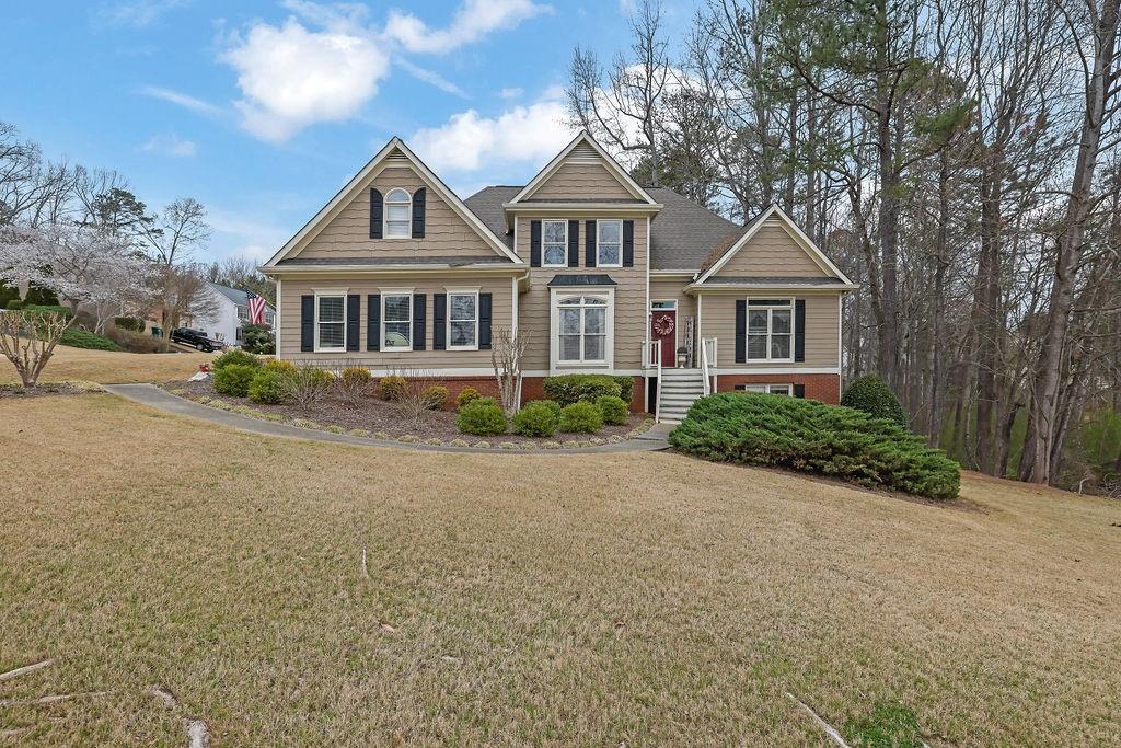 front view of a house next to a yard