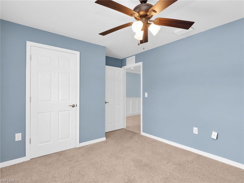 731 Hadley Place West Naples, FL 34104 - Photo 4 of 30 Bedroom 2 With Ceiling Fan and Closet