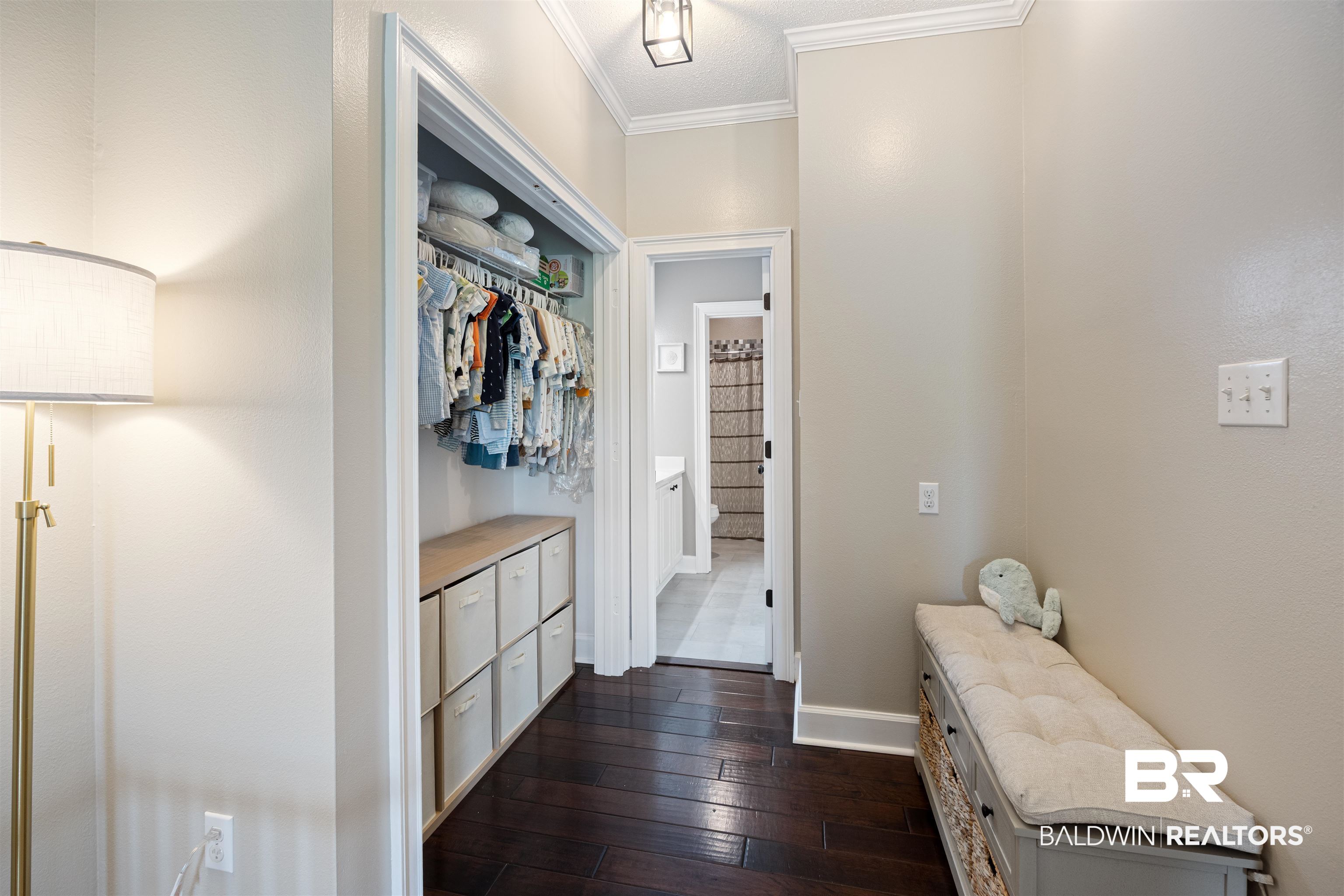 9855 Stucki Road Elberta, AL 36530 - Photo 39 of 54 Mudroom featuring ornamental molding and dark wood-style flooring