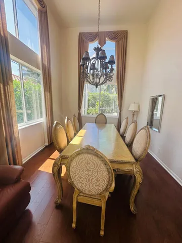 a view of a dining room with furniture window and outside view