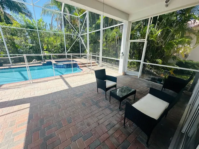 a view of a chairs and table in the terrace