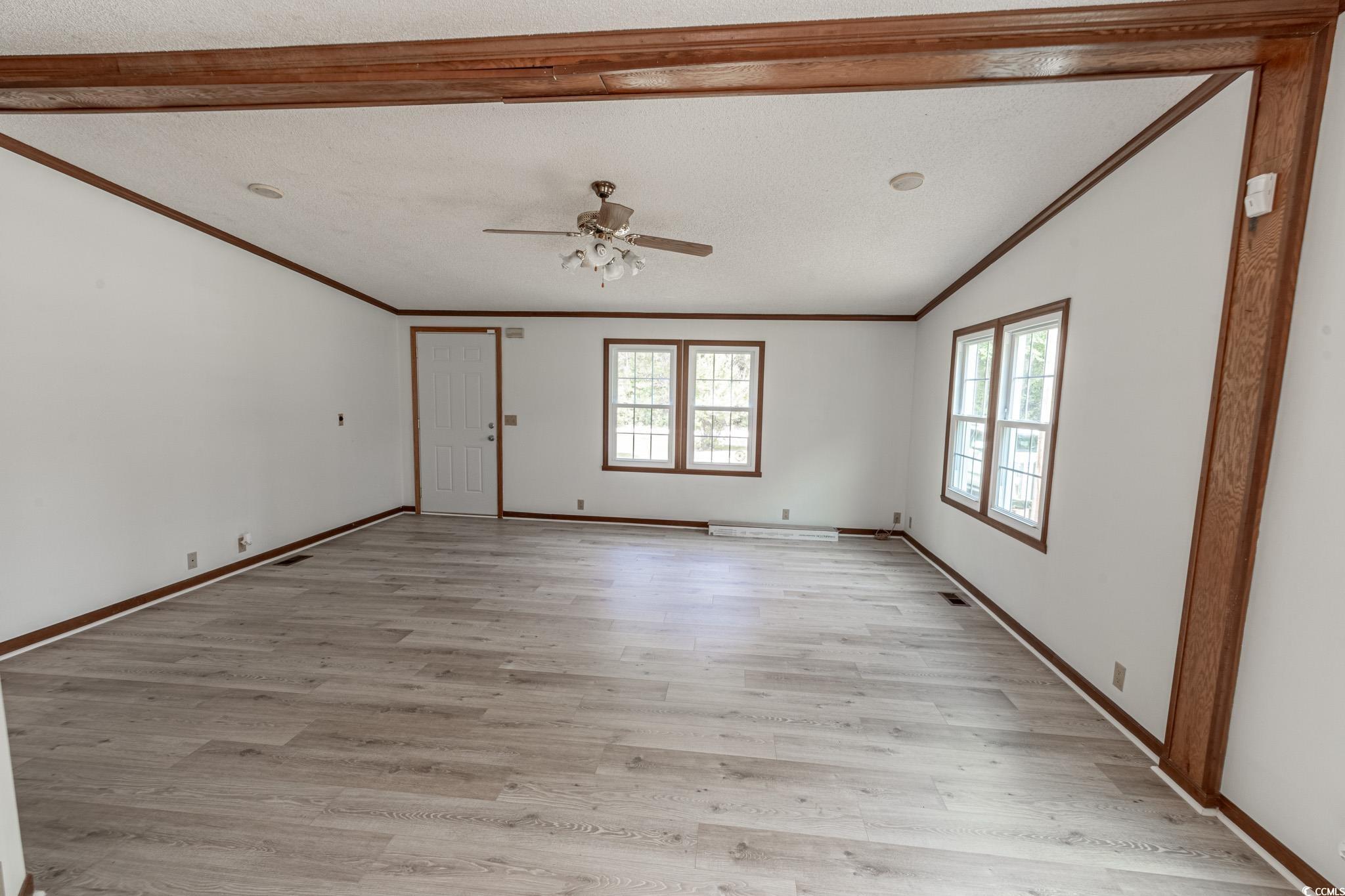 2150 Hazel Road Conway, SC 29526 - Photo 11 of 28 Empty room with light wood-type flooring, a textur