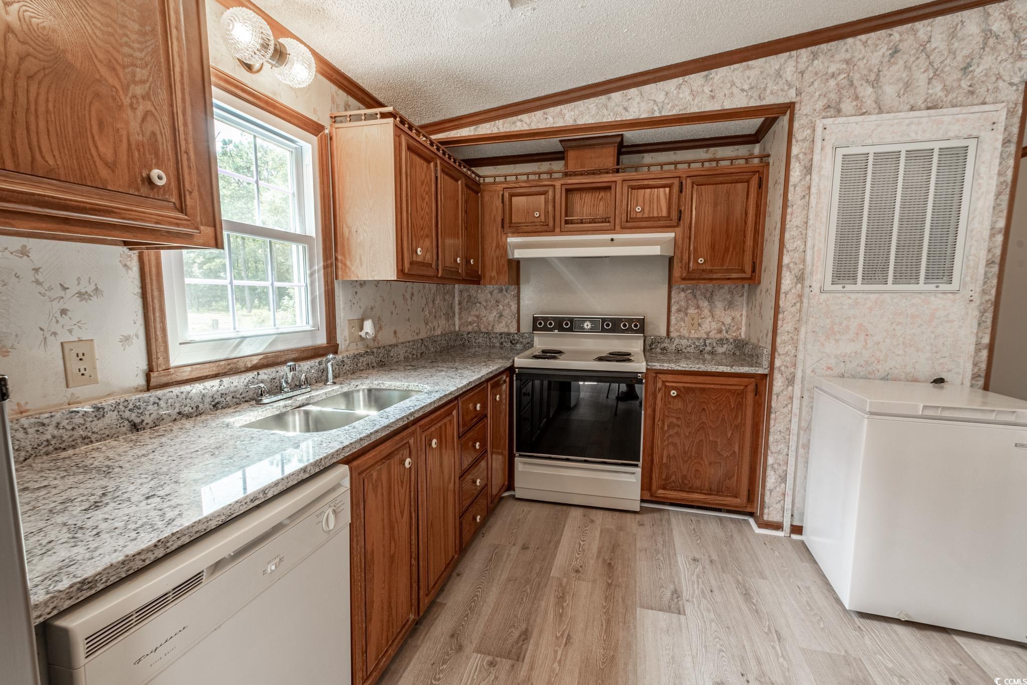 2150 Hazel Road Conway, SC 29526 - Photo 13 of 28 Kitchen featuring vaulted ceiling, light hardwood