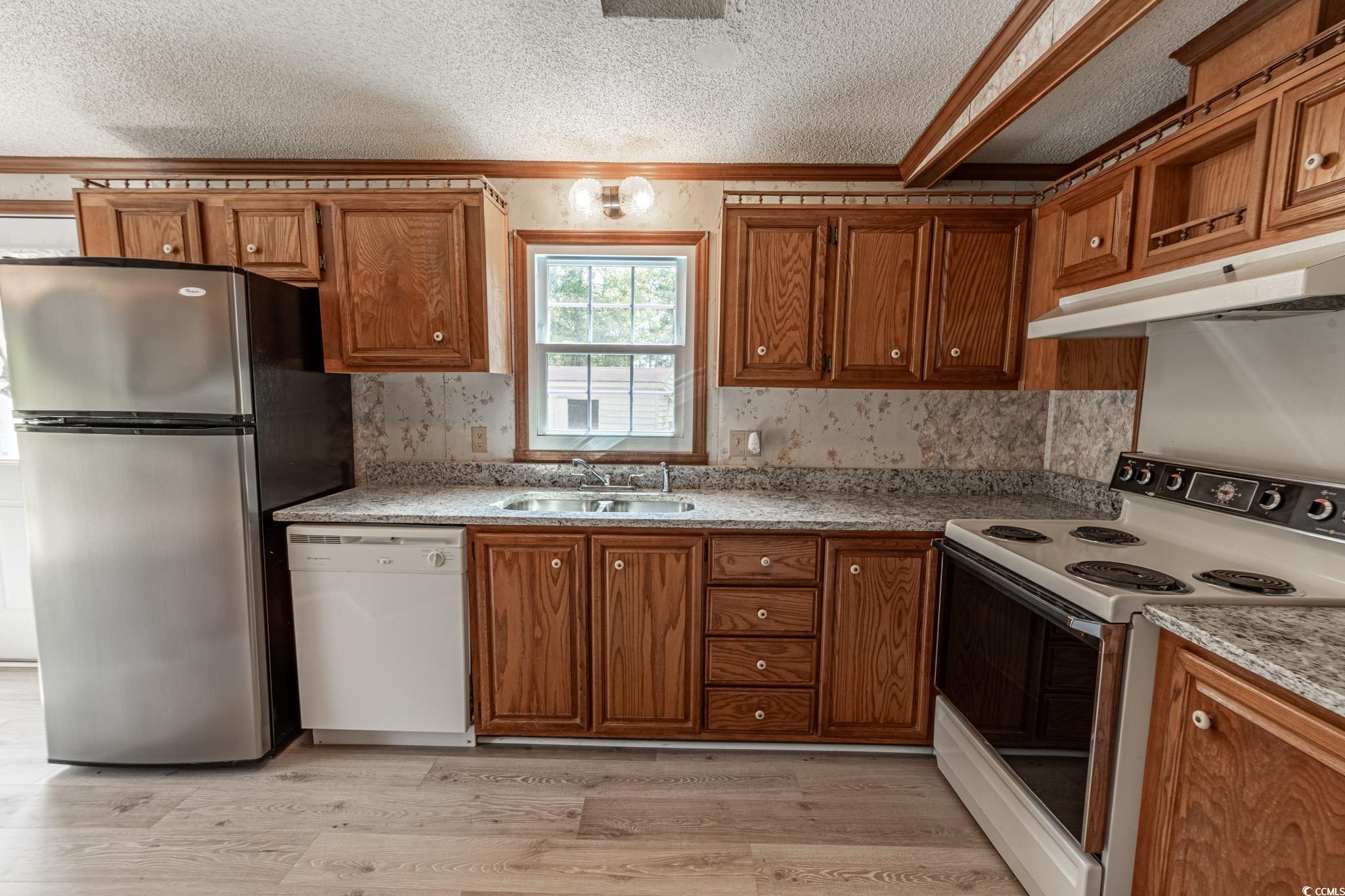 2150 Hazel Road Conway, SC 29526 - Photo 14 of 28 Kitchen with white appliances, light hardwood / wo