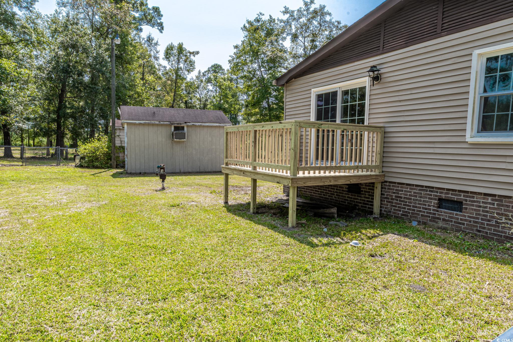 2150 Hazel Road Conway, SC 29526 - Photo 24 of 28 View of yard featuring a storage shed and a deck