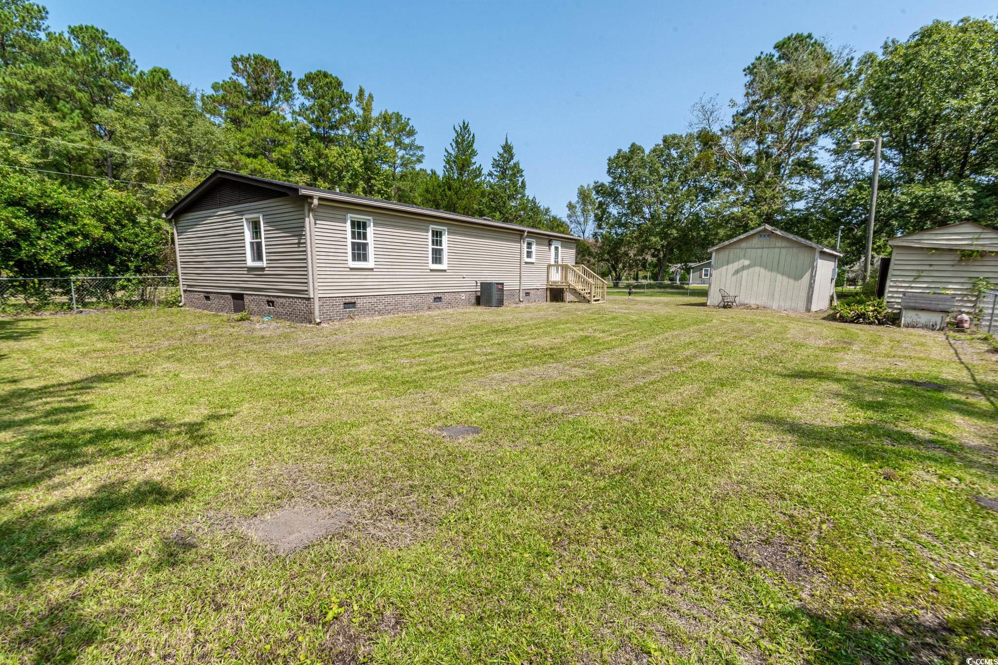 2150 Hazel Road Conway, SC 29526 - Photo 25 of 28 View of yard with central AC and a shed