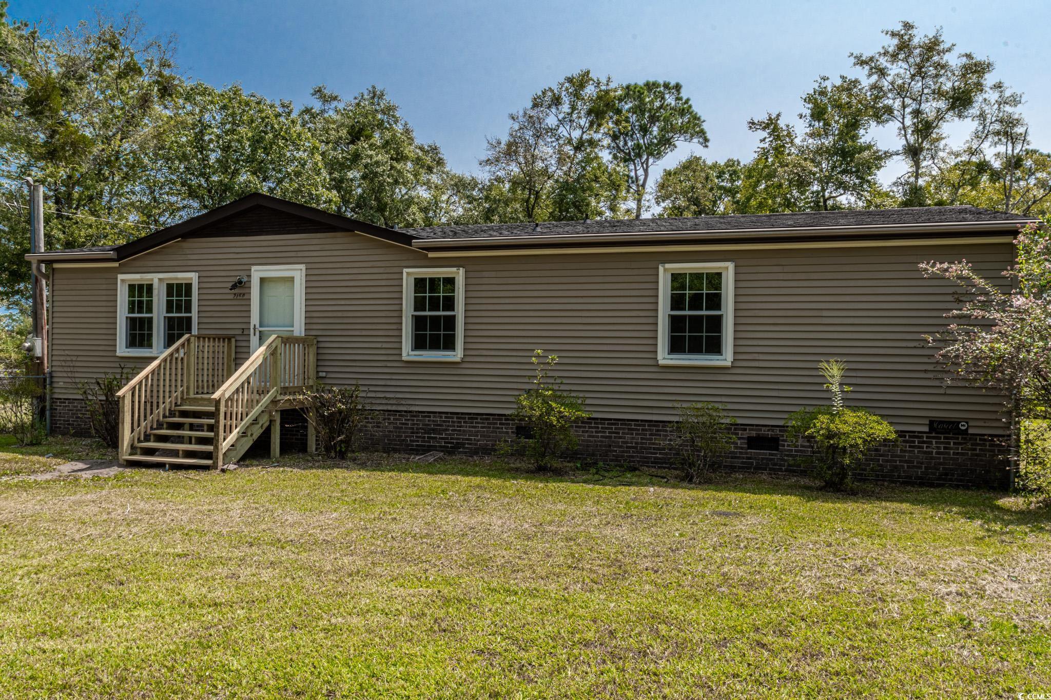 2150 Hazel Road Conway, SC 29526 - Photo 28 of 28 Rear view of property featuring a lawn