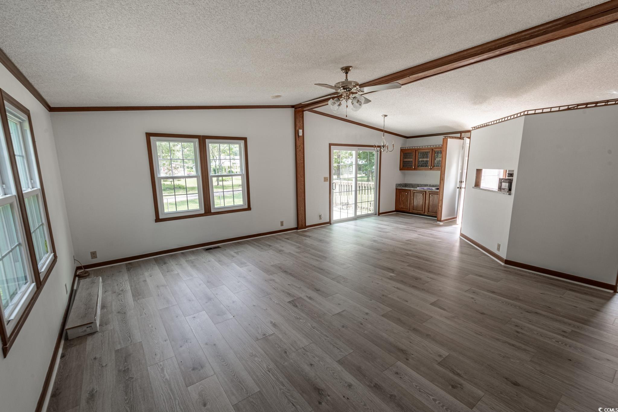 2150 Hazel Road Conway, SC 29526 - Photo 10 of 28 Unfurnished living room featuring crown molding, v
