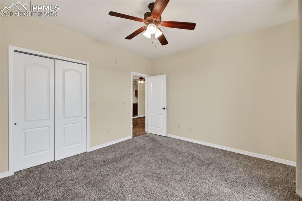 5378 Palomino Ranch Point, Unit 208 Colorado Springs, CO 80922 - Photo 25 of 38 a view of a room with a ceiling fan