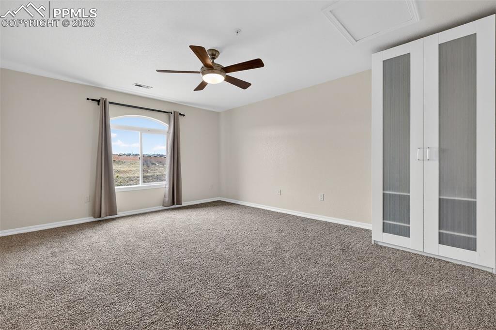 5378 Palomino Ranch Point, Unit 208 Colorado Springs, CO 80922 - Photo 29 of 38 a view of an empty room with a window