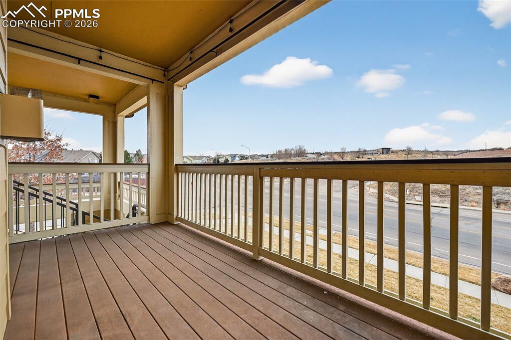 5378 Palomino Ranch Point, Unit 208 Colorado Springs, CO 80922 - Photo 9 of 38 a view of a balcony with wooden floor