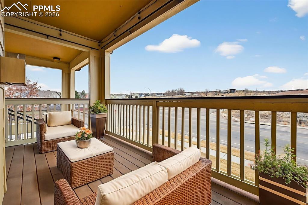 5378 Palomino Ranch Point, Unit 208 Colorado Springs, CO 80922 - Photo 10 of 38 a roof deck with couches and wooden floor