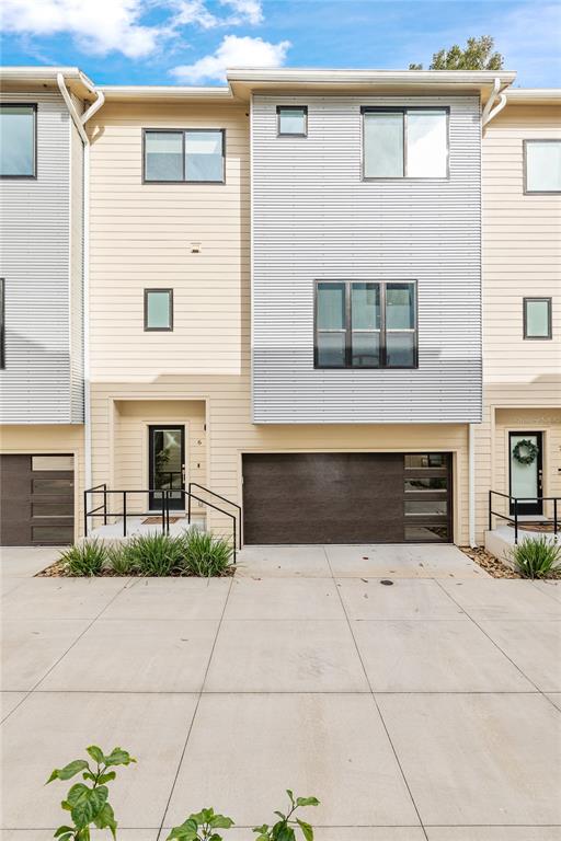 2601 Southwest Williston Road, Unit 106 Gainesville, FL 32608 - Photo 1 of 82 a front view of a house with yard