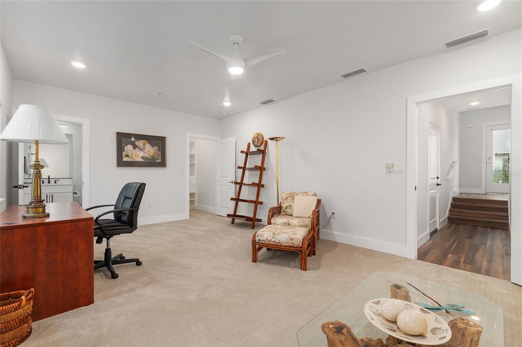 2601 Southwest Williston Road, Unit 106 Gainesville, FL 32608 - Photo 12 of 82 a room with furniture and a chair