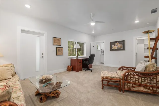 a living room with fireplace furniture and a wooden floor