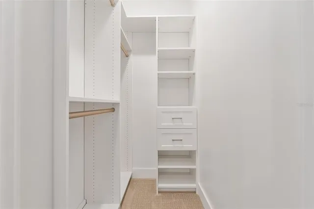 a kitchen with stainless steel appliances a refrigerator and a stove top oven
