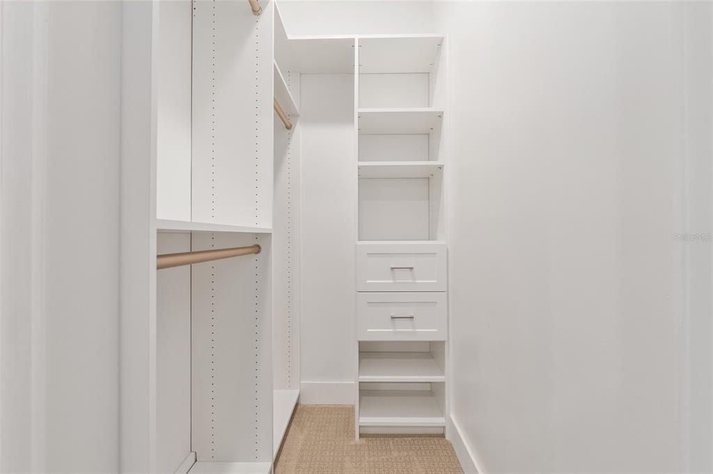 2601 Southwest Williston Road, Unit 106 Gainesville, FL 32608 - Photo 17 of 82 a view of walk in closet with empty racks