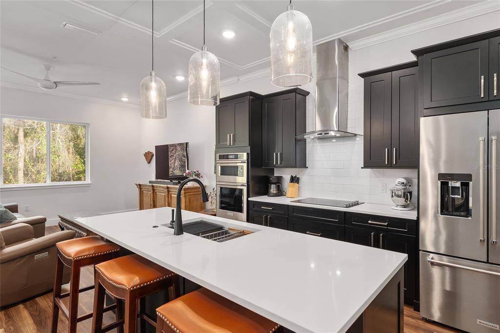 2601 Southwest Williston Road, Unit 106 Gainesville, FL 32608 - Photo 22 of 82 a kitchen with stainless steel appliances a sink counter space and refrigerator