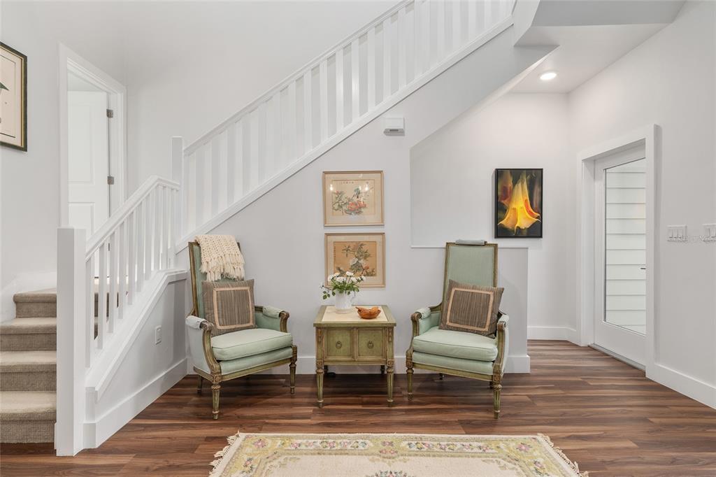 2601 Southwest Williston Road, Unit 106 Gainesville, FL 32608 - Photo 24 of 82 a living room with fireplace furniture and a wooden floor