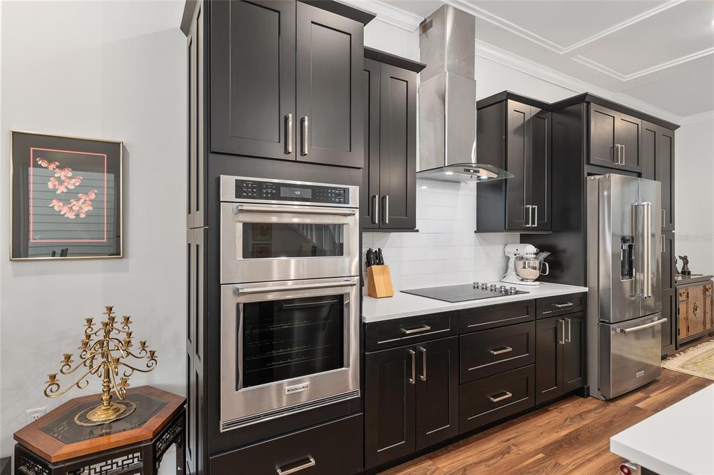 2601 Southwest Williston Road, Unit 106 Gainesville, FL 32608 - Photo 30 of 82 a kitchen with stainless steel appliances granite countertop a refrigerator stove and sink