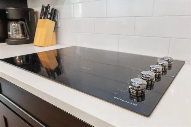 a bedroom with a bed and windows