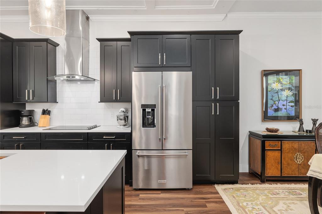 2601 Southwest Williston Road, Unit 106 Gainesville, FL 32608 - Photo 34 of 82 a kitchen with stainless steel appliances a refrigerator and a stove top oven