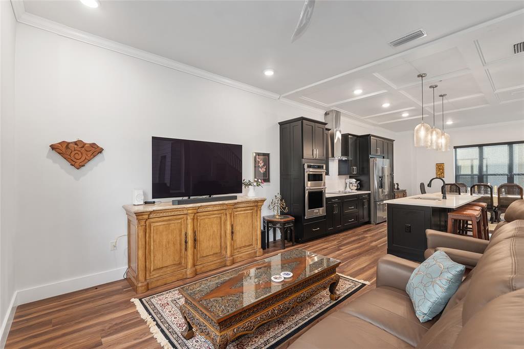 2601 Southwest Williston Road, Unit 106 Gainesville, FL 32608 - Photo 41 of 82 a living room with furniture and a flat screen tv