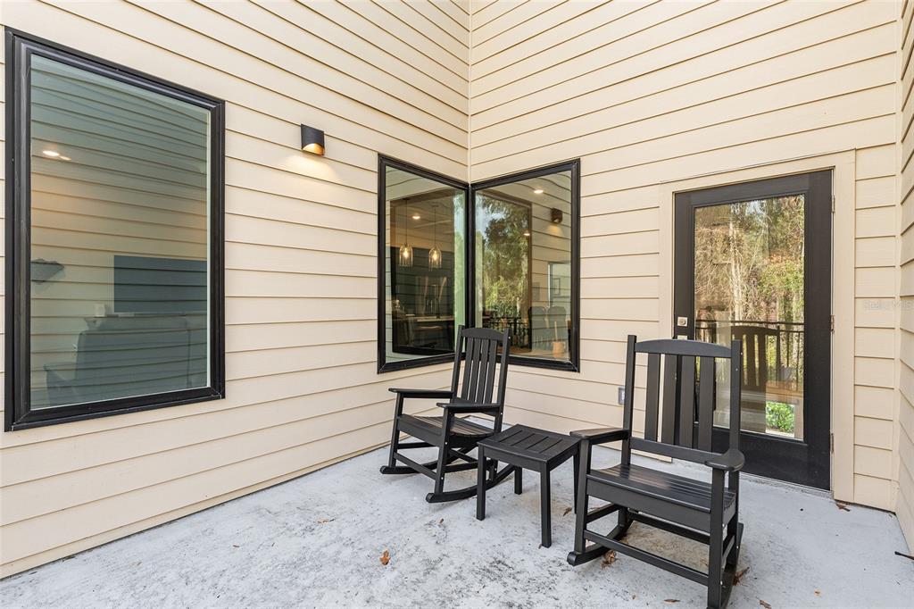 2601 Southwest Williston Road, Unit 106 Gainesville, FL 32608 - Photo 47 of 82 a view of a two chairs in the balcony