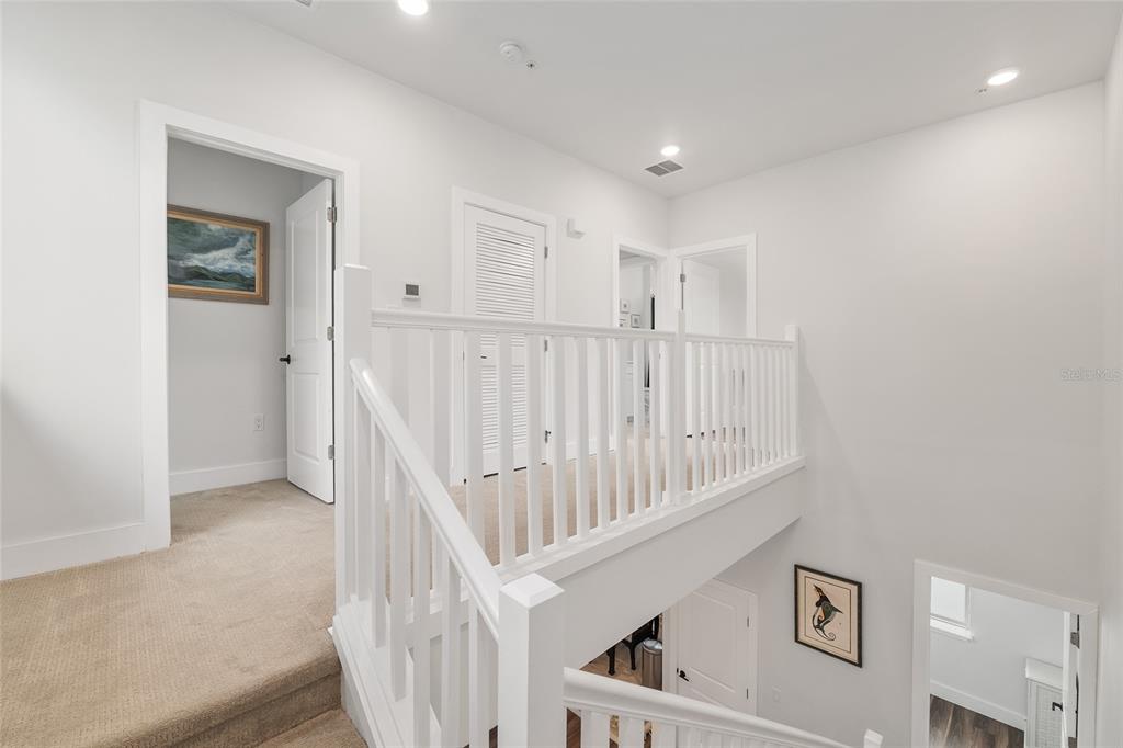 2601 Southwest Williston Road, Unit 106 Gainesville, FL 32608 - Photo 49 of 82 a view of staircase with white walls
