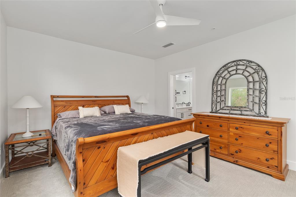 2601 Southwest Williston Road, Unit 106 Gainesville, FL 32608 - Photo 53 of 82 a bed room with a bed and a dresser