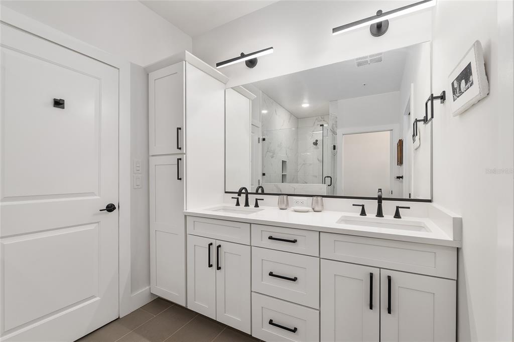 2601 Southwest Williston Road, Unit 106 Gainesville, FL 32608 - Photo 56 of 82 a bathroom with a sink double vanity and a mirror